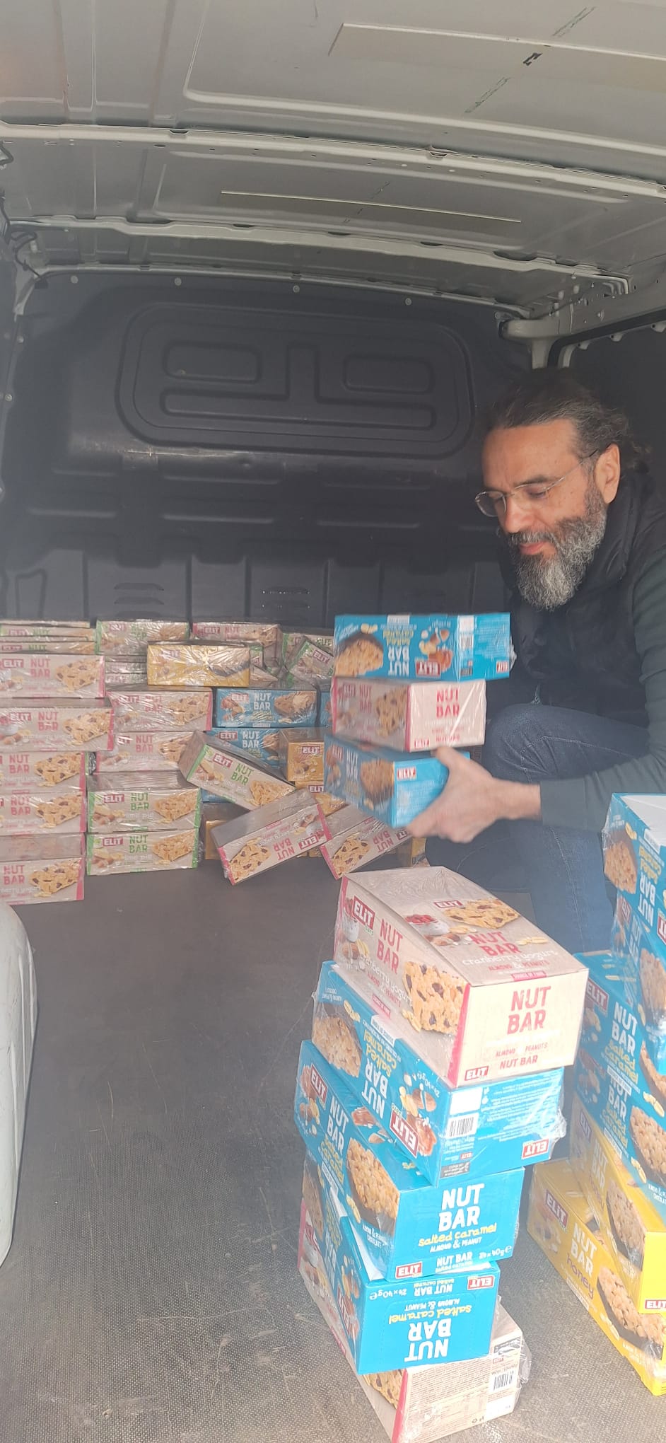 Loading boxes of NutBar cereal bars into the van
